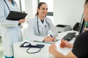 A-compassionate-primary-care-doctor-discusses-treatment-options-with-a-patient-in-the-clinic