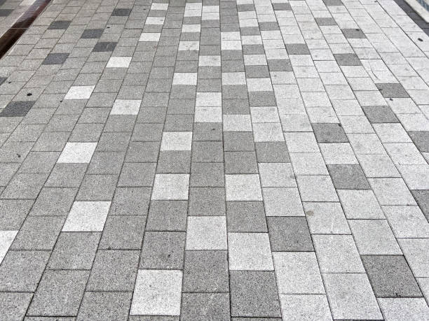 Sidewalk block with white and black bricks
